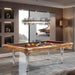 Luxury Etrusco Smile pool table in olive wood with brown felt and crystal-clear legs, set in a stylish lounge with designer lighting.