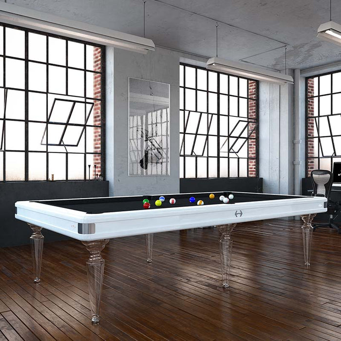 Contemporary Etrusco Smile pool table with white frame and black cloth, clear legs and wooden flooring in a loft-style studio.