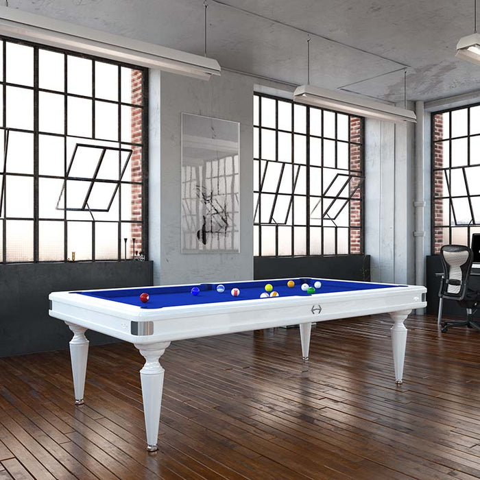 Modern Etrusco Smile pool table with a white frame and blue cloth, placed in a loft-style room with rich wooden flooring.