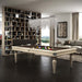 Etrusco Smile pool table with white wood finish and brown cloth in a classic-modern living space with bookcase backdrop.