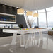 All-white Etrusco Strike pool table in a contemporary high-rise apartment with panoramic city views and minimalistic decor.