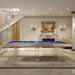 Etrusco Strike pool table with beige wood frame and blue cloth, featuring acrylic legs in a grand, elegant living space.