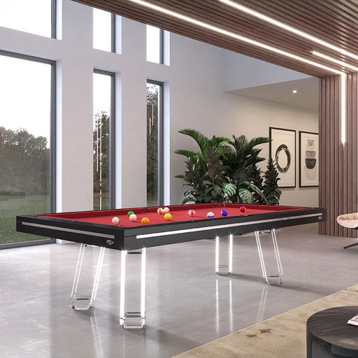 Etrusco Strike pool table in sleek black finish with red cloth and transparent legs, set in a modern luxury games room.