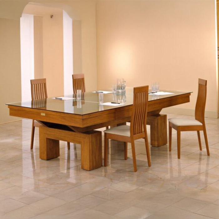 Etrusco Top pool table in a classic wooden finish, transformed into a glass-top dining table in a minimal and warm-toned space.