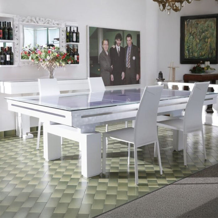 Etrusco Top pool table with a white frame and glass top, arranged in a stylish bar area for dual-purpose use as a modern dining table.