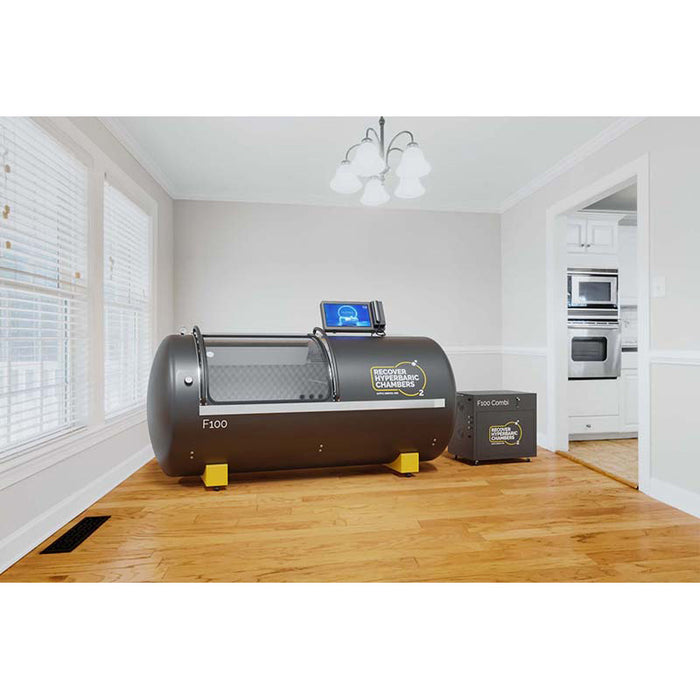 Side view of F100 Recover F100 Hyperbaric Chamber with equipment in residential setting.