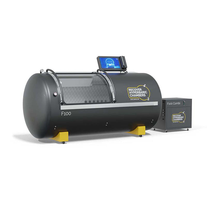 Angled view of black Recover F100 Hyperbaric Chamber with equipment.