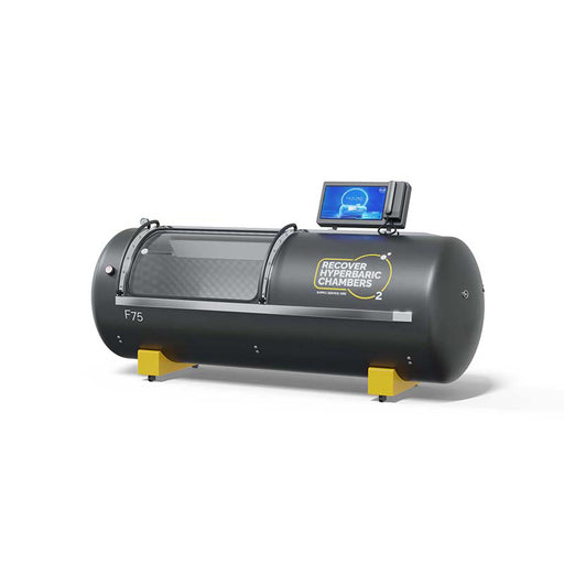 Angled view of black Recover F75 steel hyperbaric chamber with digital monitor.