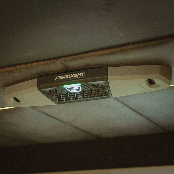 Foresight Falcon golf launch monitor installed on a dark acoustic ceiling, highlighting its modern overhead tracking system and premium finish.