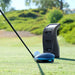 Close-up of golf driver and Foresight GC3 Launch Monitor before tee-off, capturing pre-shot tracking setup.