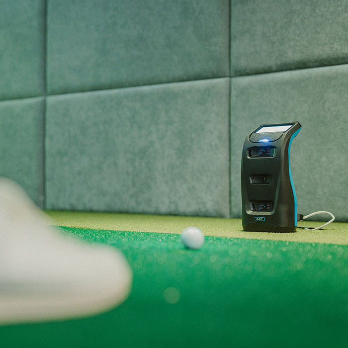 Foresight GC3S Launch Monitor placed near golf ball indoors, ready to record precise club and ball data in a simulator environment.