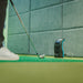 Side view of golfer preparing to putt or chip indoors, with Foresight GC3S Launch Monitor ready for short game tracking.