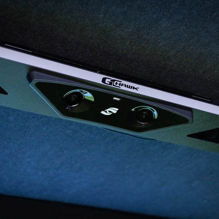 Ceiling-mounted Foresight GCHawk launch monitor unit with dual camera lenses, designed for precision ball and club tracking.