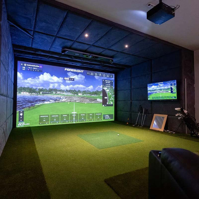 Complete indoor golf simulator installation with Foresight GCHawk overhead launch monitor, dual-screen setup, and luxury interior design.