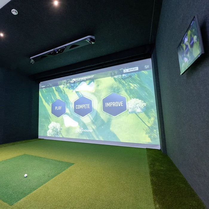 Modern indoor golf simulator room equipped with Foresight GCHawk launch monitor and interactive user interface for training and gameplay.