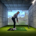 Golfer at address position in a golf simulator using the Foresight GCQuad for accurate shot tracking.