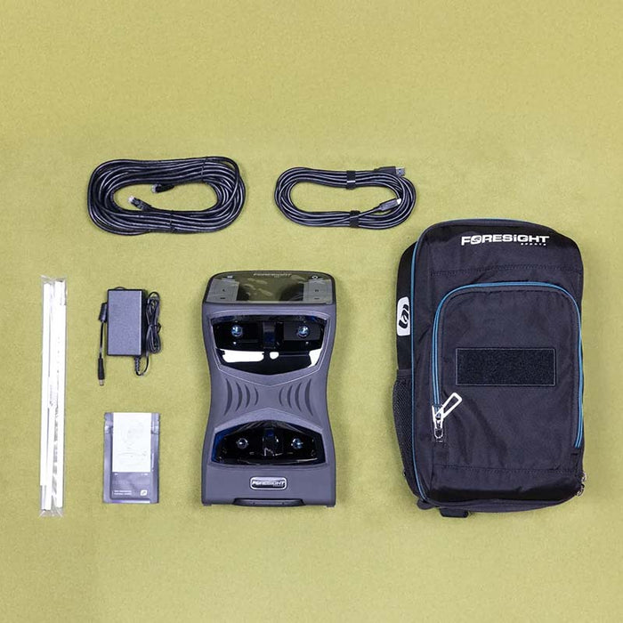 Full contents of the Foresight QuadMAX package including monitor, cables, power adapter, and carry bag on display.