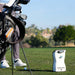 Foresight QuadMAX launch monitor on the fairway next to a golfer and their bag, ready for on-course swing data capture.