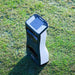 Foresight QuadMAX launch monitor positioned on grassy golf range under bright outdoor conditions, ideal for real-time shot analysis.