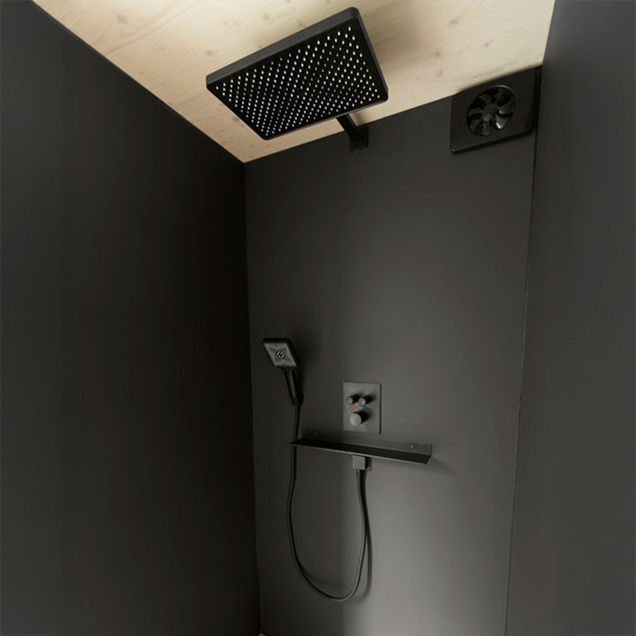 Stylish matte black shower system inside Geneva St. Moritz outdoor sauna’s shower room, featuring a rainfall head and minimalist design.