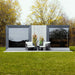 Front-facing view of Geneva St. Moritz outdoor sauna with shower room, framed by trees in bloom and minimalist decor.