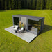 Modern Geneva St. Moritz outdoor sauna cabin with shower room, set in a scenic forest clearing, featuring sleek black-framed glass panels and stylish patio seating.
