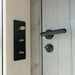 Close-up of matte black handle and golden toggle switches inside Geneva St. Moritz outdoor sauna, highlighting premium interior fittings.