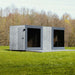 Geneva St. Moritz outdoor sauna cabin with shower room, viewed from the side, featuring modern vertical timber cladding and large glass panels.