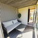 Indoor-to-sauna view from the Geneva St. Moritz outdoor unit, showing seamless transition to the sauna cabin with panoramic glazing.