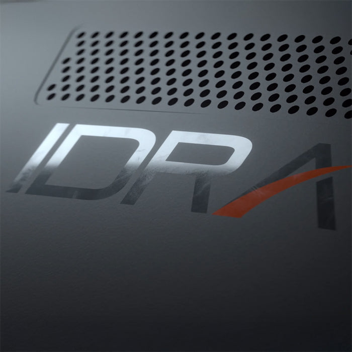 Macro view of GolfIn IDRA II Launch Monitor casing with branded IDRA logo and precision-cut ventilation, highlighting sleek industrial design and build quality.