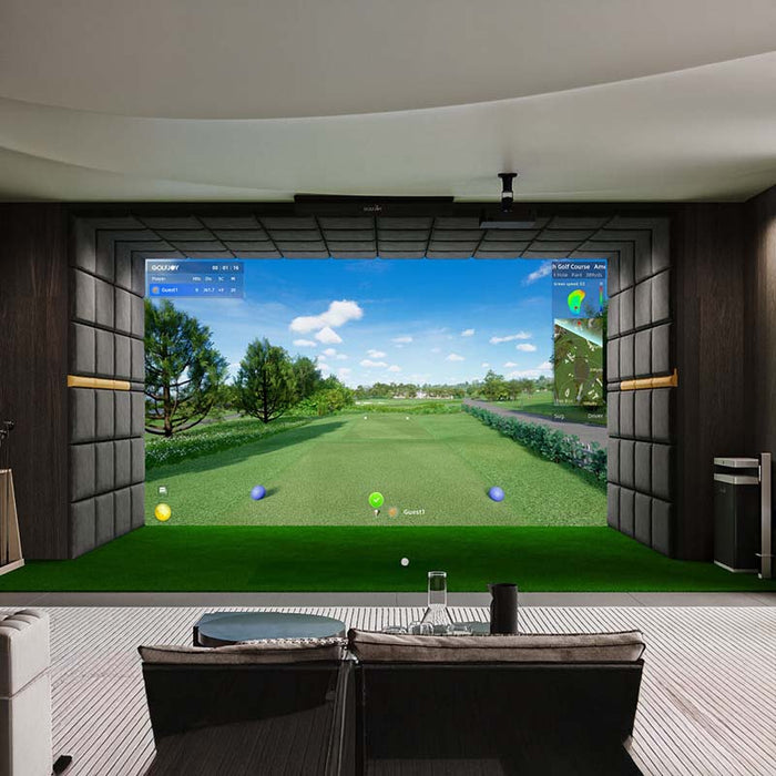 Luxurious office setup featuring a Golfjoy commercial golf simulator with a large screen displaying a scenic golf course.