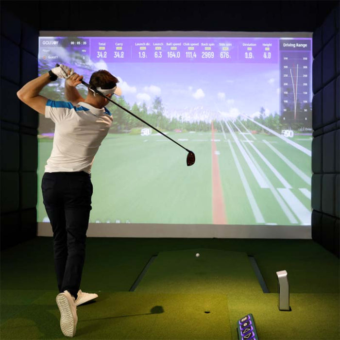Indoor practice setup featuring the Golfjoy GDS Plus Launch Monitor, providing precise shot analysis for off-course training.