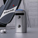 Golfjoy GDS Pro Launch Monitor next to a golf bag, emphasising its portability and compact build for easy transport.