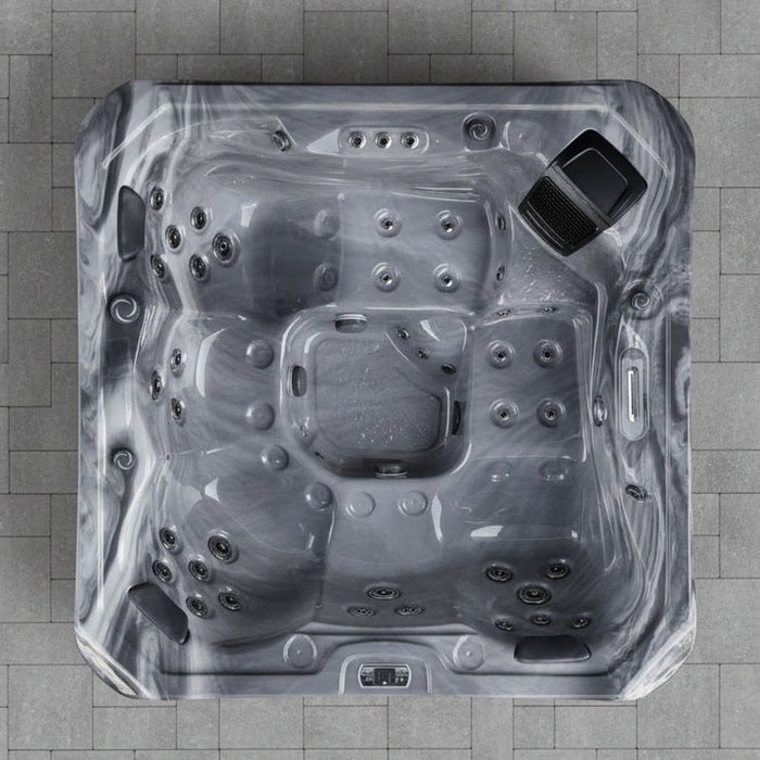 Overhead view of the H2O Coral 5-Person Hot Tub interior showing full jet layout, seating configuration, and built-in speaker