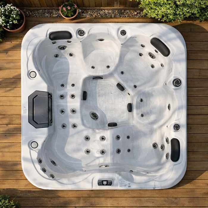 H2O Retreat Pro 5-Person Hot Tub aerial view showing full seating layout, jet configuration, and lounge seat position, installed on a timber deck