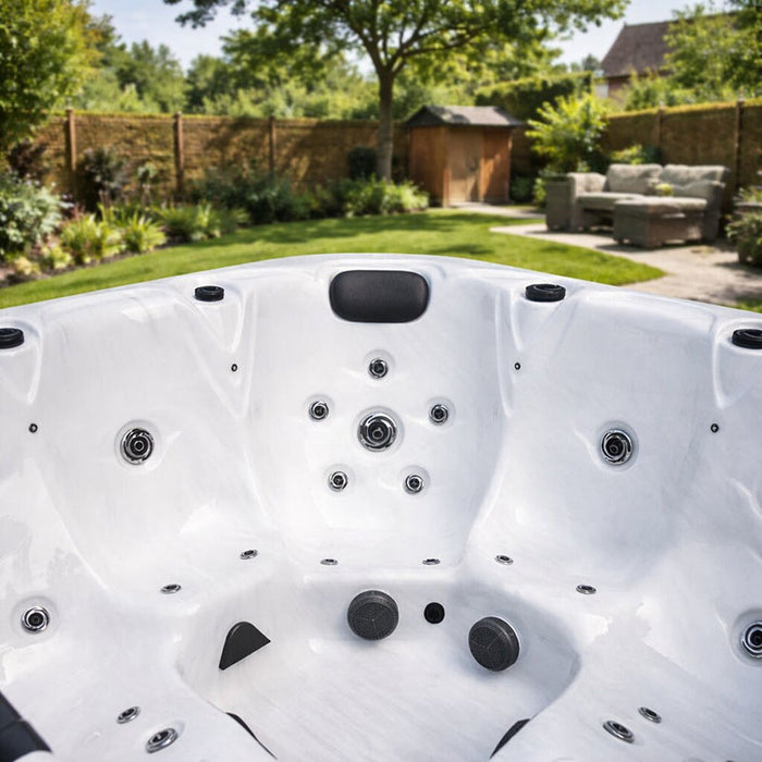 H2O Retreat Pro 5-Person Hot Tub white acrylic interior close-up showing contoured seating, jet placement, and footwell design