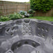 H2O Vortex 6-Person Hot Tub grey interior close-up highlighting concentrated stainless steel jet cluster and moulded headrest position