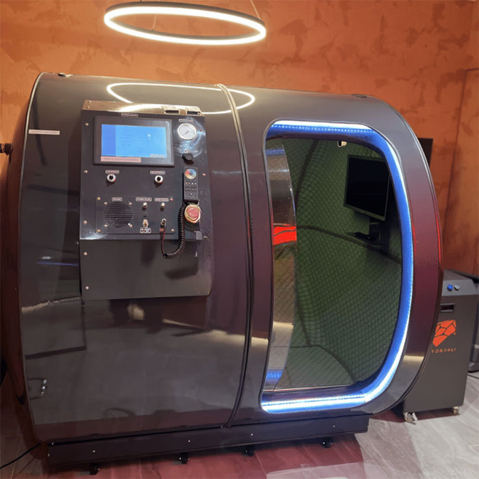 Front view of the Henshaw Duoplace Chamber showcasing its high-tech control panel, blue LED lighting, and spacious dual-seating interior for oxygen therapy sessions.
