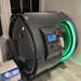 Side angle view of Henshaw Duoplace Chamber illuminated with green LED, highlighting its modern curved design and integrated monitoring system.