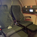 Interior view of the Henshaw Duoplace Hyperbaric Oxygen Chamber featuring two luxury reclining seats, control panel, and quilted walls for dual-person oxygen therapy.