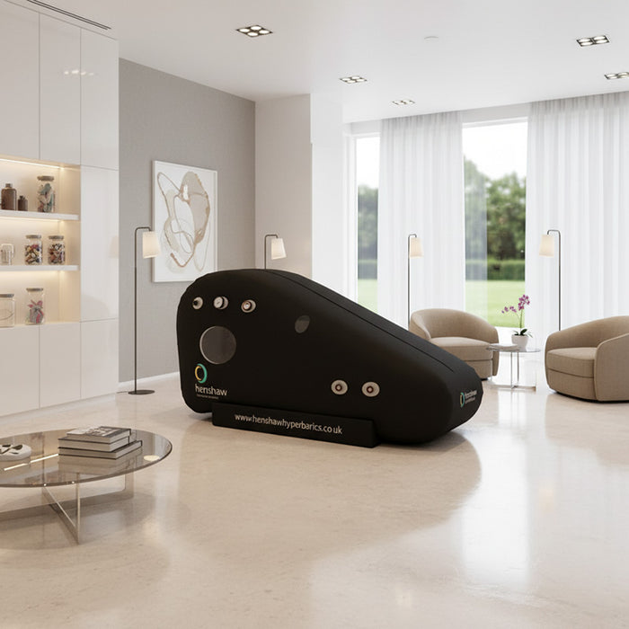 Sleek Henshaw Recline Hyperbaric Oxygen Chamber placed in a stylish living room, suitable for luxury wellness centres.