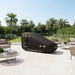 Outdoor installation of the Henshaw Recline Hyperbaric Chamber on a patio with palm trees, ideal for wellness retreats.