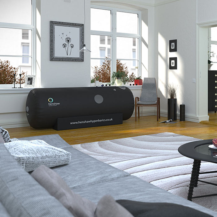 Henshaw Space Hyperbaric Oxygen Chamber seamlessly integrated into a stylish living room, highlighting residential wellness and convenience.