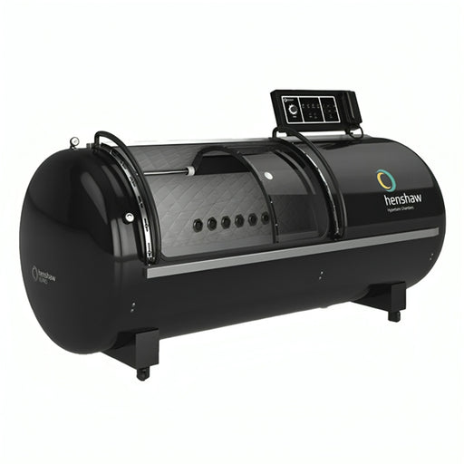 Henshaw XL Pro Hyperbaric Oxygen Chamber in a sleek black design with transparent acrylic door, pressure control panel, and quilted interior lining for premium oxygen therapy treatments.