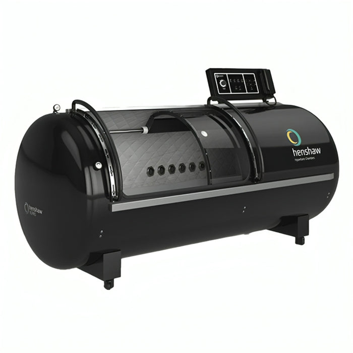 Henshaw XL Pro Hyperbaric Oxygen Chamber in a sleek black design with transparent acrylic door, pressure control panel, and quilted interior lining for premium oxygen therapy treatments.