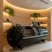 Henshaw XL Pro Hyperbaric Oxygen Chamber placed in a softly lit wood-panelled spa setting, enhancing tranquillity and comfort for rejuvenating oxygen therapy sessions.