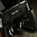 Close-up of the ImSim ALMA racing simulator seat harness system with heavy-duty racing straps and hardware.