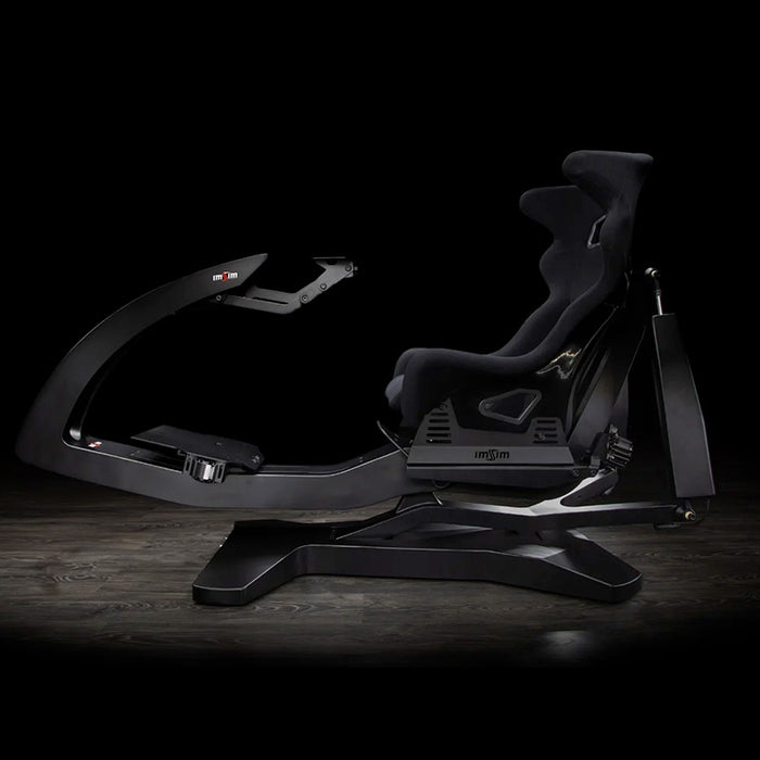 ImSim ALMA racing simulator cockpit with integrated seat, adjustable wheel mount and premium sim racing chassis side view.