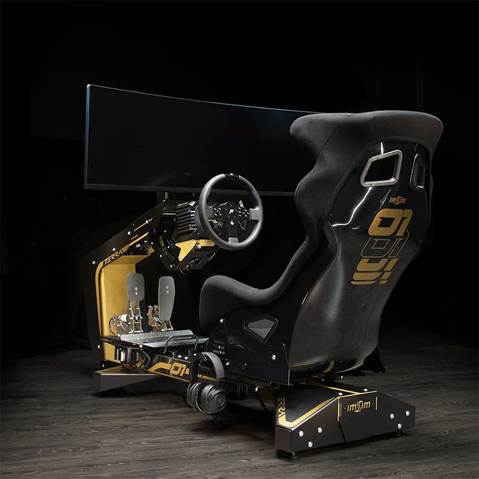 Rear three-quarter view of the ImSim TERRA sim racing cockpit with bucket seat, monitor mount and black and gold chassis.