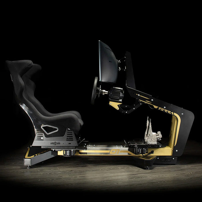 Side elevation of the ImSim TERRA racing simulator showing ergonomic racing seat, wheel mount and pedal platform in black and gold.